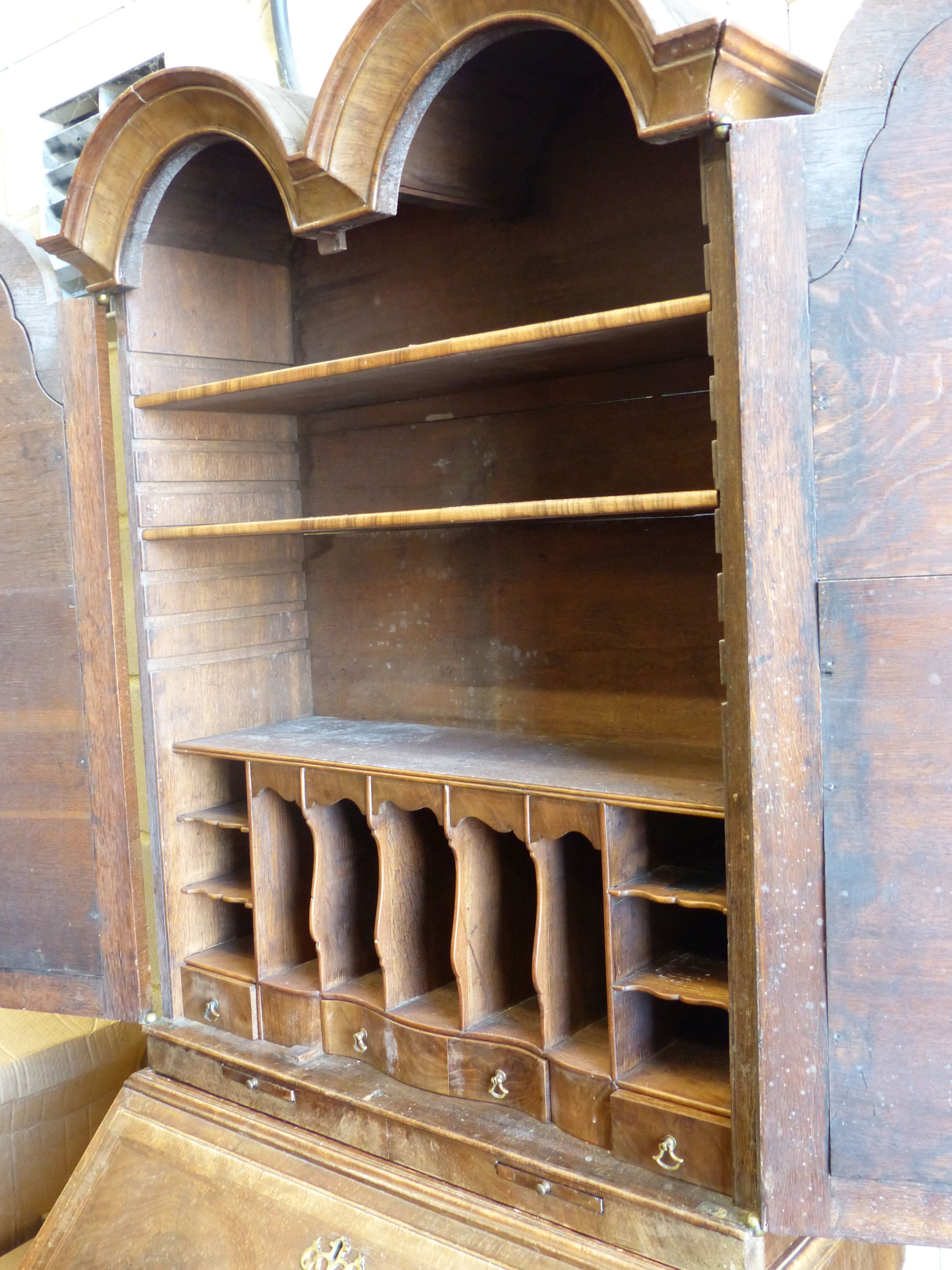 A Queen Anne style walnut double domed top bureau bookcase, length 72cm, width 50cm, height 196cm